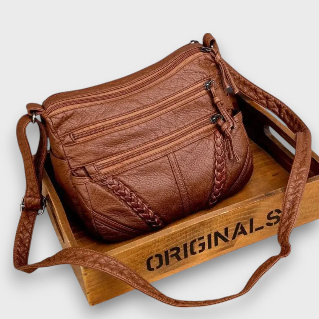 Tirella – Crossbody-Tasche mit Flechtdetail