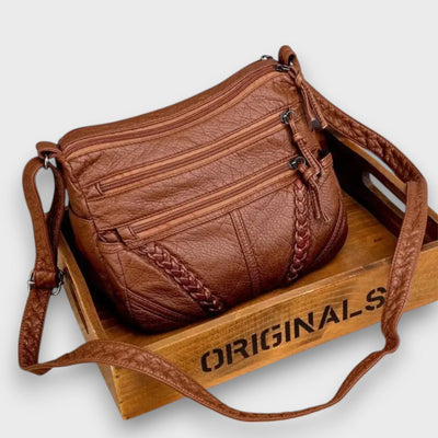 Tirella – Crossbody-Tasche mit Flechtdetail